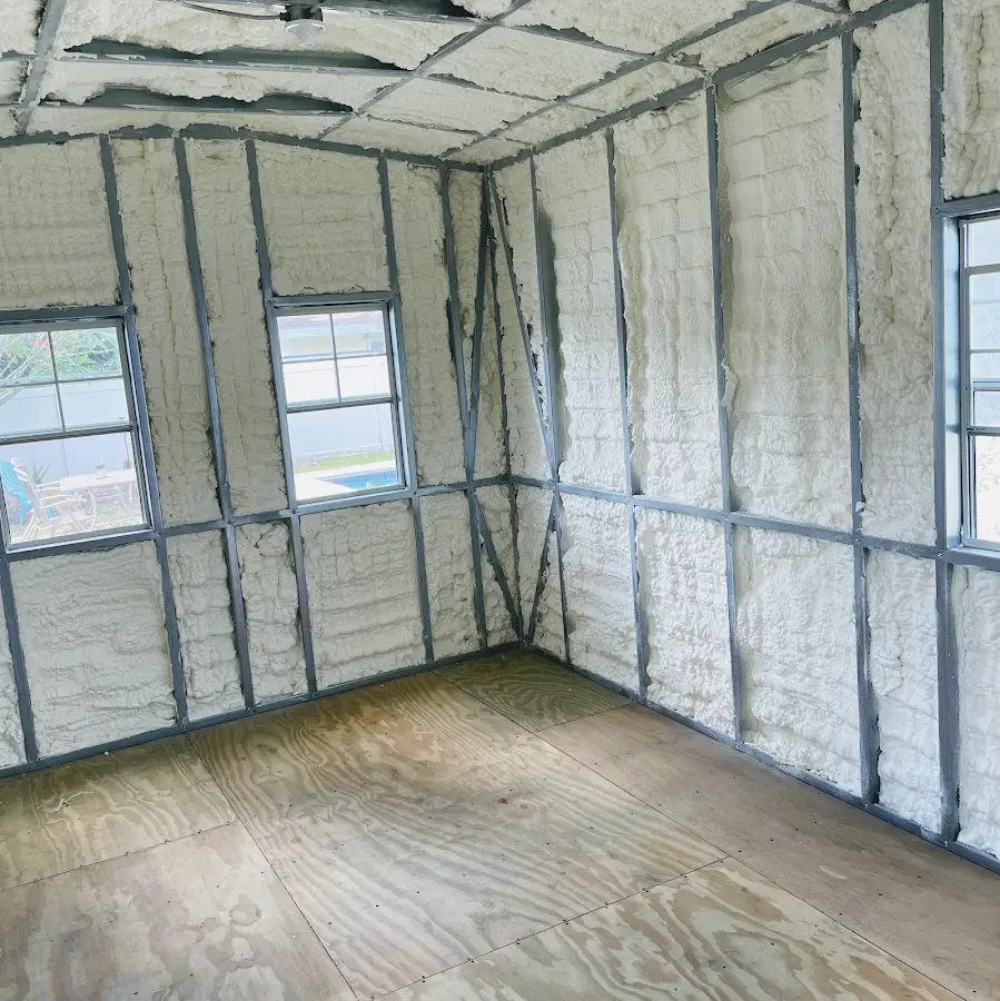 Closed-cell spray foam insulation applied to wall cavities in a residential project in Dormont